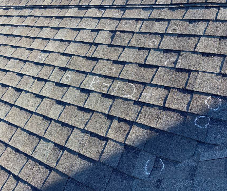 Asphalt Shingles with Multiple Chalk Markings Illustrating Roof Hail Damage Assessment for Midwest City and Moore, OK