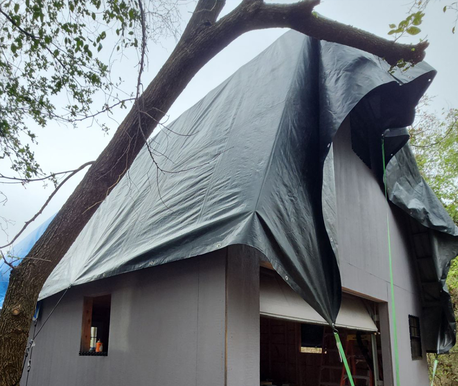 Temporary Tarp Covering a Roof Illustrating Emergency Roof Hail Damage Services for Norman and Edmond, OK